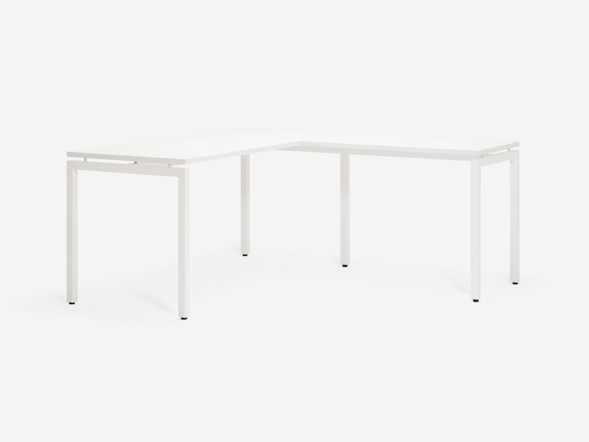 Angled view of the Novah right hand custom desk with white top and white base